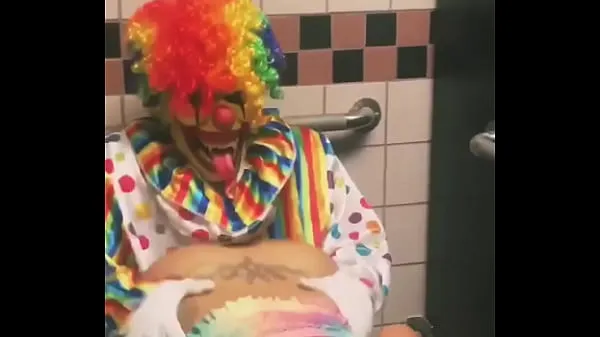 HD Girl rides clown in bathroom stall top Tube