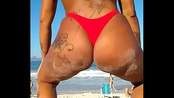 HD On the beach little bitch wiggling in thong top Tube